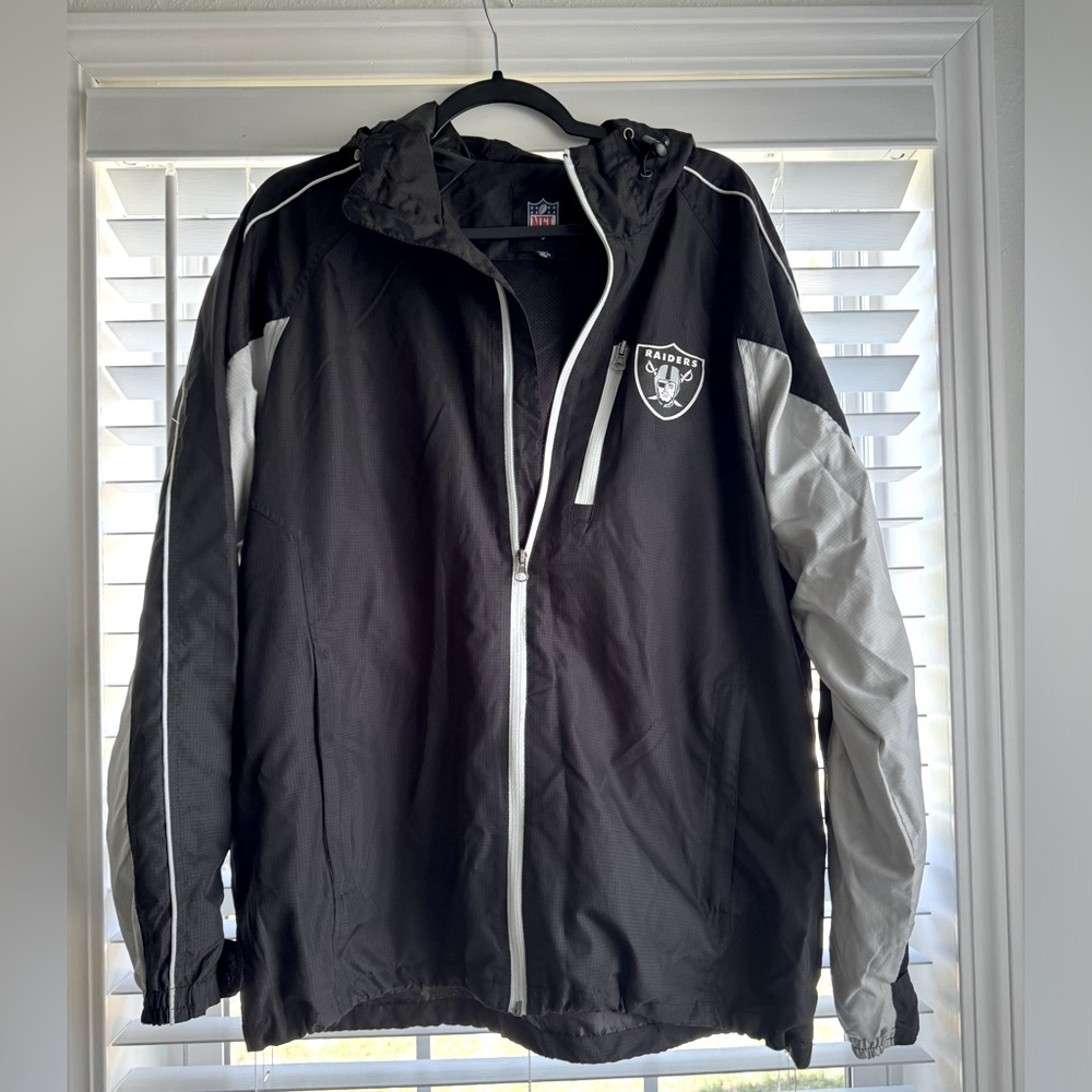 Raiders NFL wind breaker zip up jacket; men's size L